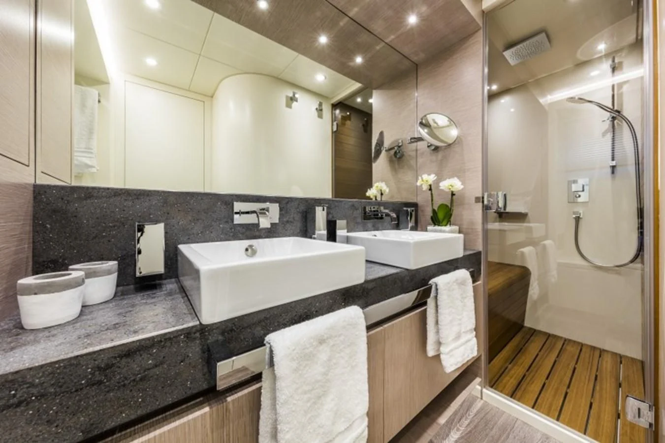 a bathroom with a large mirror aboard BULL Yacht for Sale