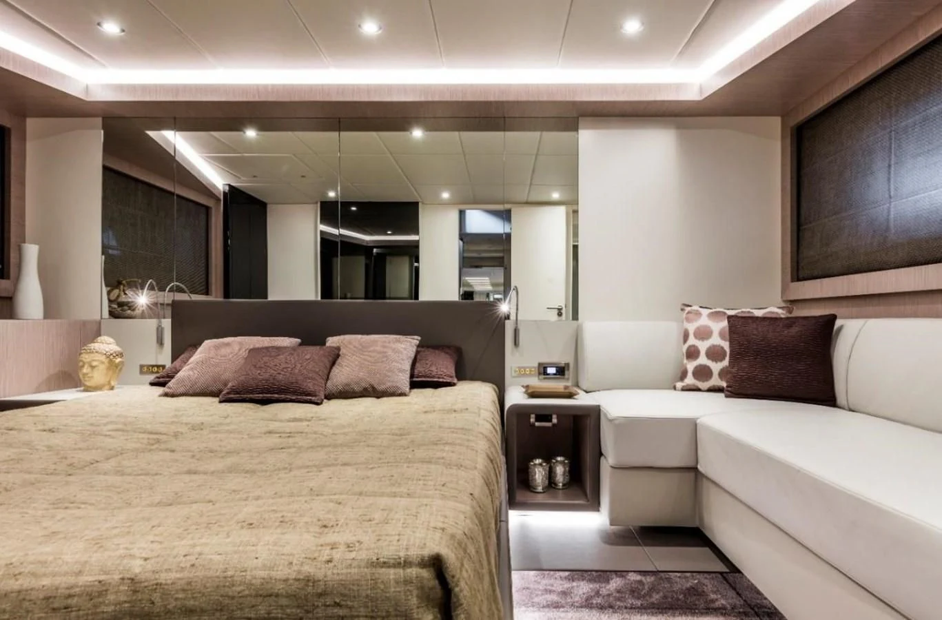 a room with a bed and a couch aboard BULL Yacht for Sale
