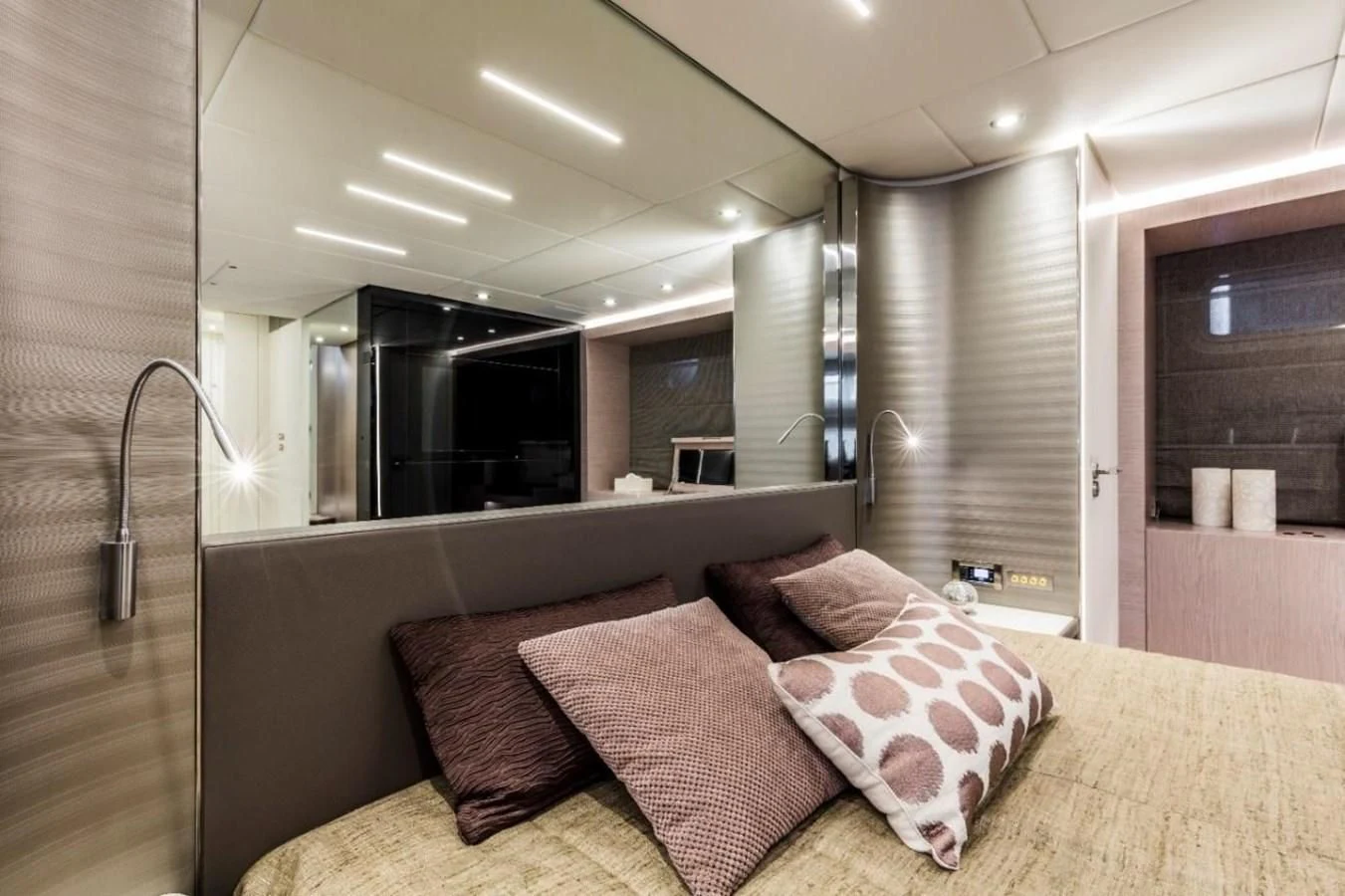 a couch with pillows on it aboard BULL Yacht for Sale