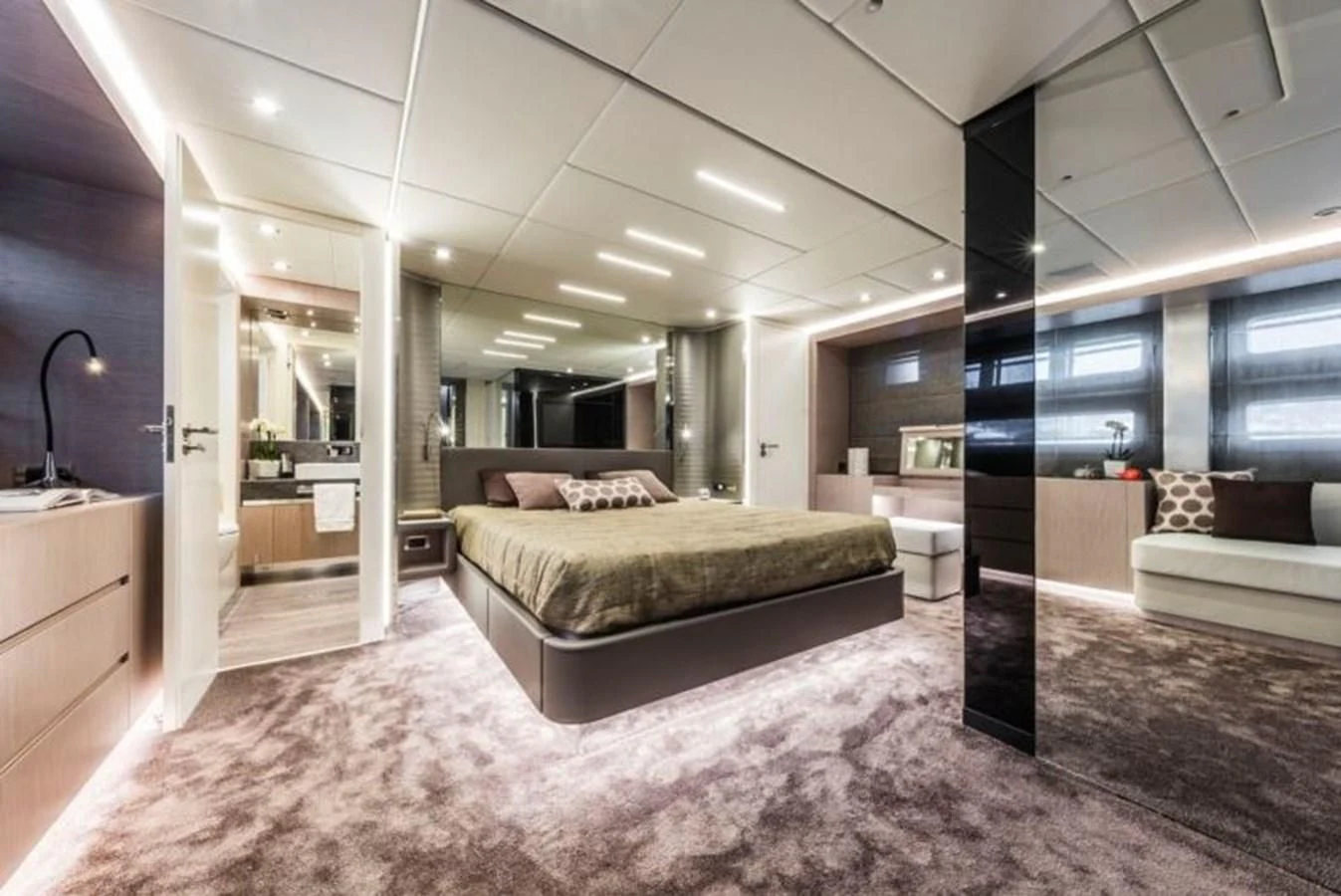 a large bedroom with a large bed aboard BULL Yacht for Sale