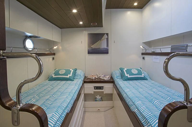 a hospital room with a bed and a blue bed aboard WISDOM Yacht for Sale