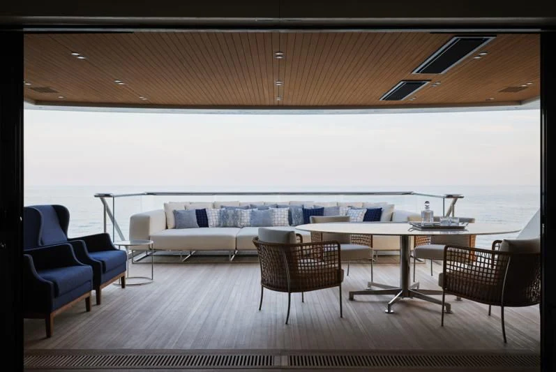 a room with a table and chairs aboard LA LA LAND Yacht for Charter