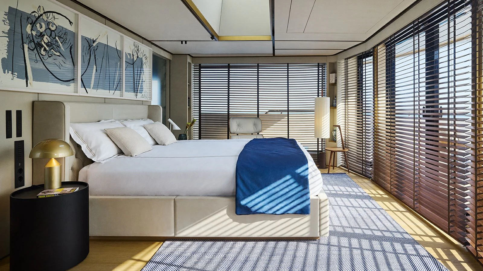 a bedroom with a large bed aboard LA LA LAND Yacht for Charter