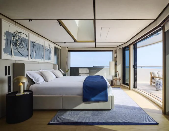 a bedroom with a large bed aboard LA LA LAND Yacht for Charter