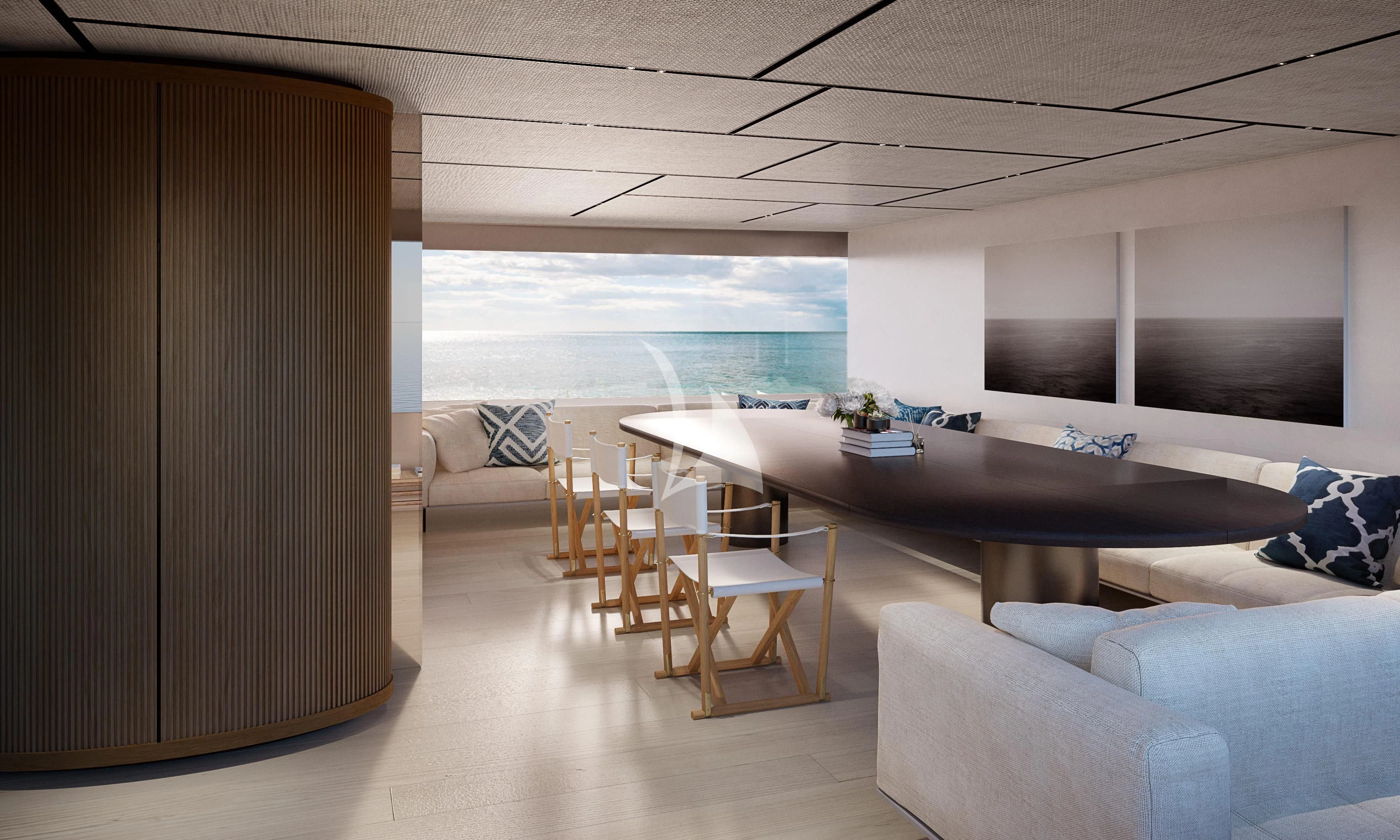 a room with a table and couches aboard LA LA LAND Yacht for Charter