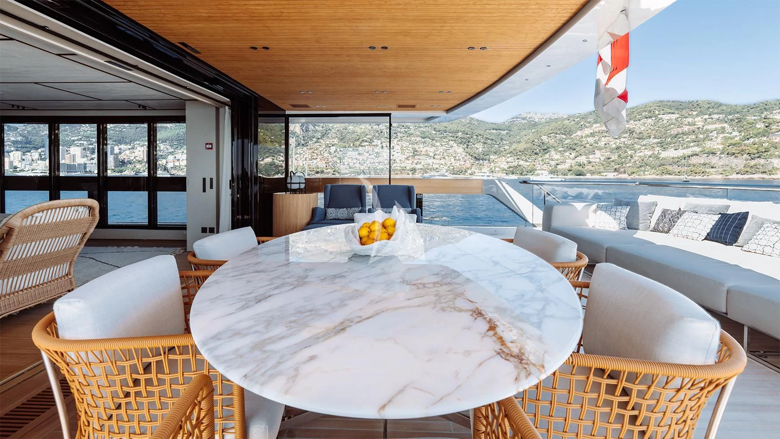 a table and chairs on a deck aboard LA LA LAND Yacht for Charter