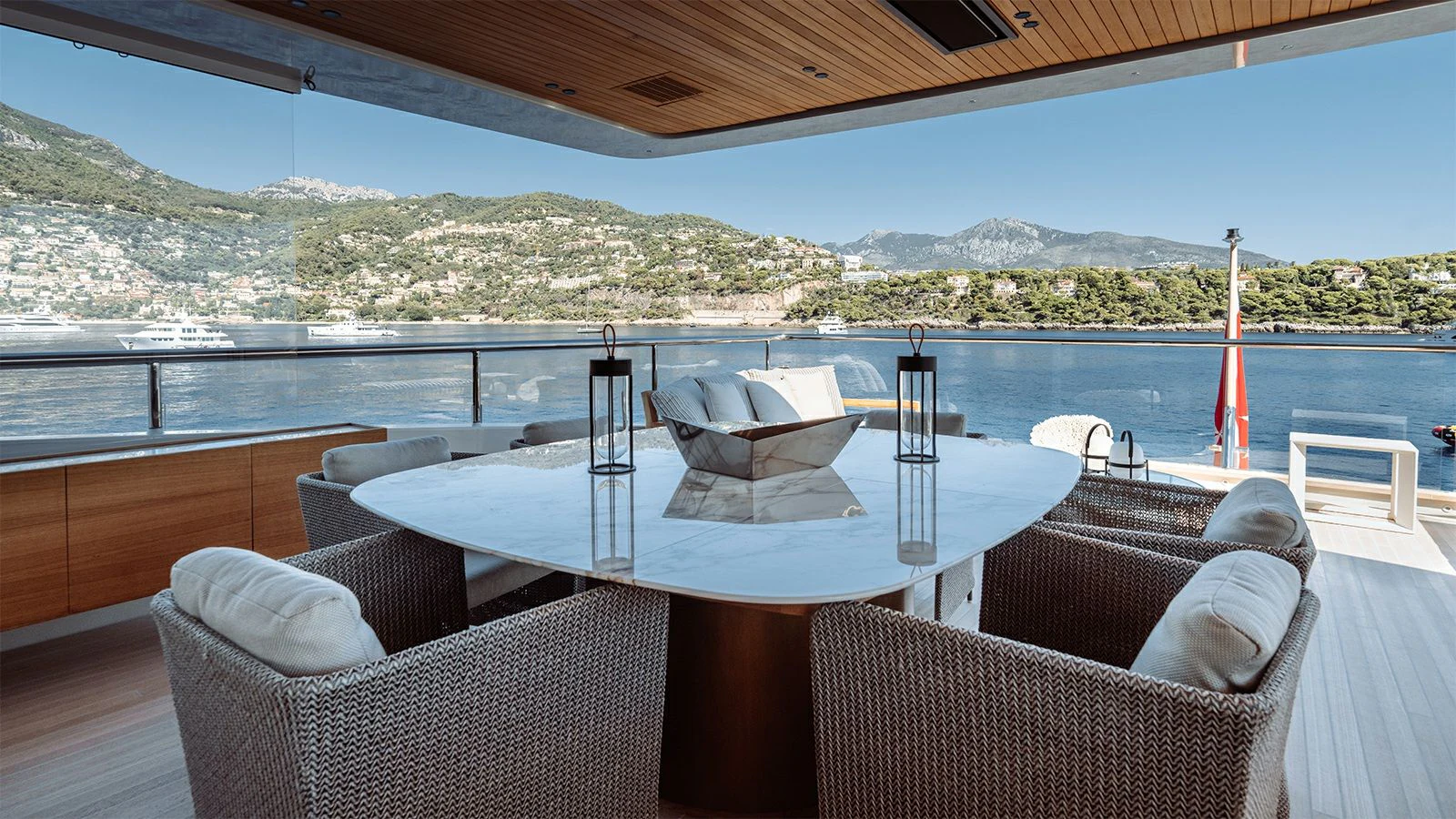 a table and chairs on a deck aboard LA LA LAND Yacht for Charter