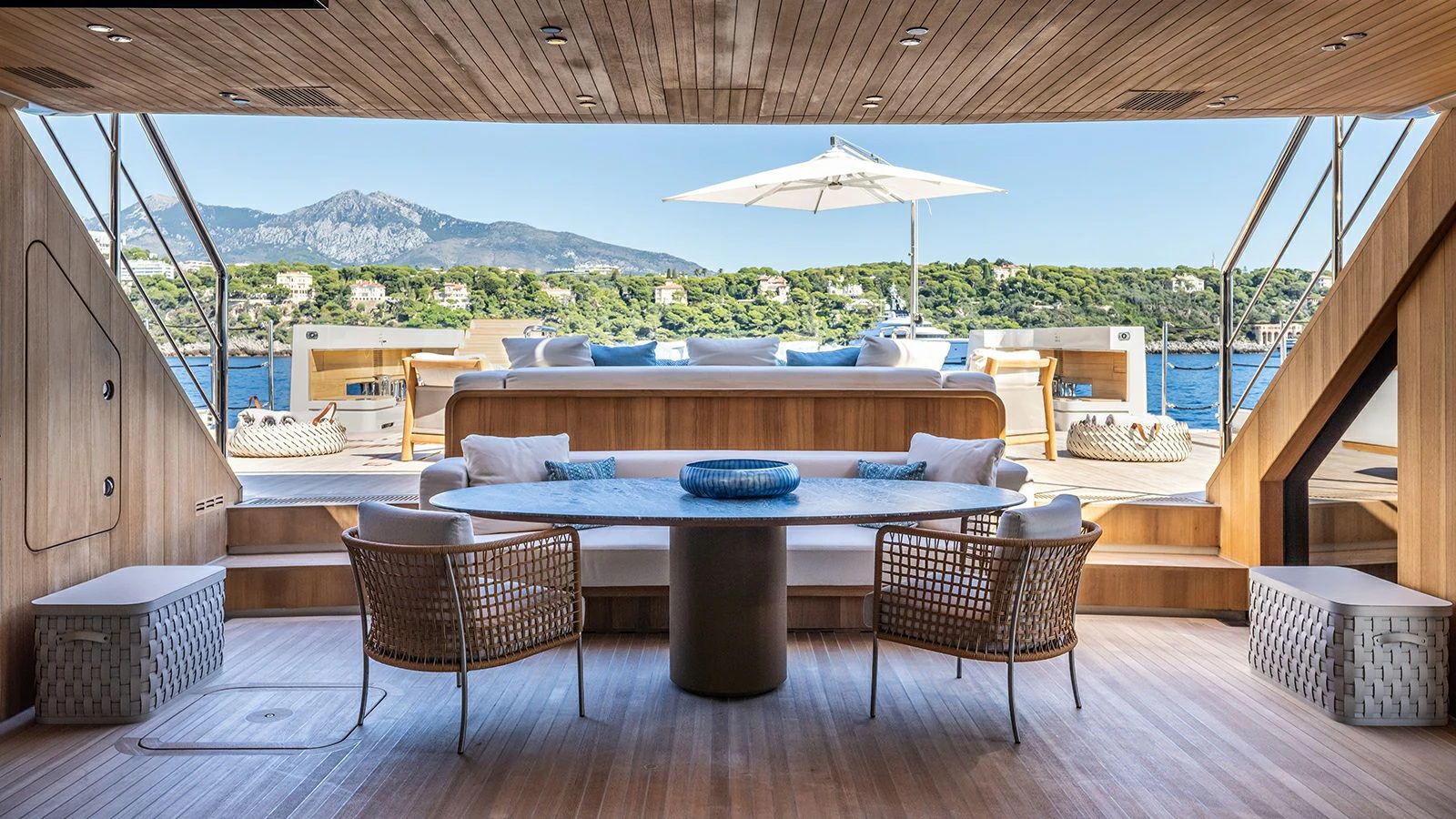 a patio with a table and chairs aboard LA LA LAND Yacht for Charter