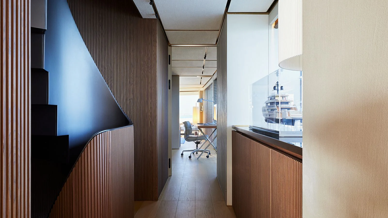 a hallway with a desk and chairs aboard LA LA LAND Yacht for Charter