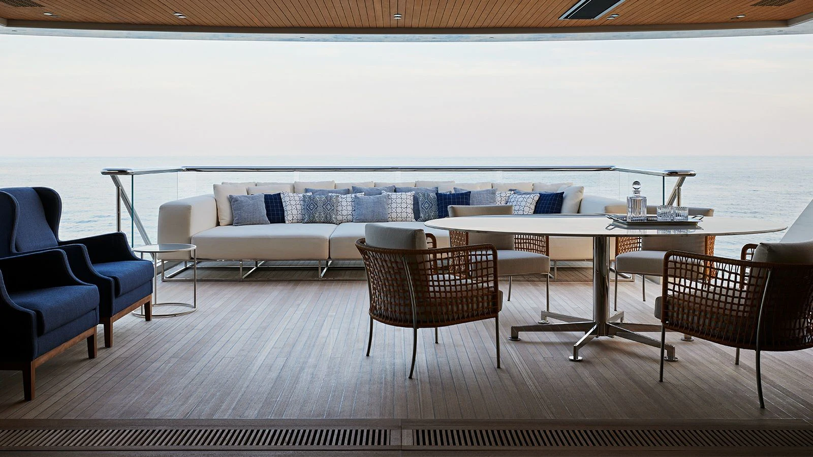 a room with a table chairs and a couch aboard LA LA LAND Yacht for Charter