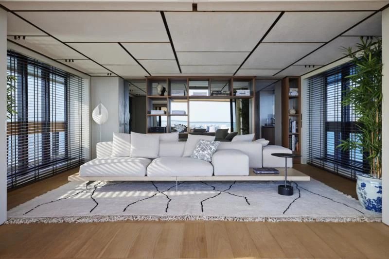 a living room with a large window aboard LA LA LAND Yacht for Charter