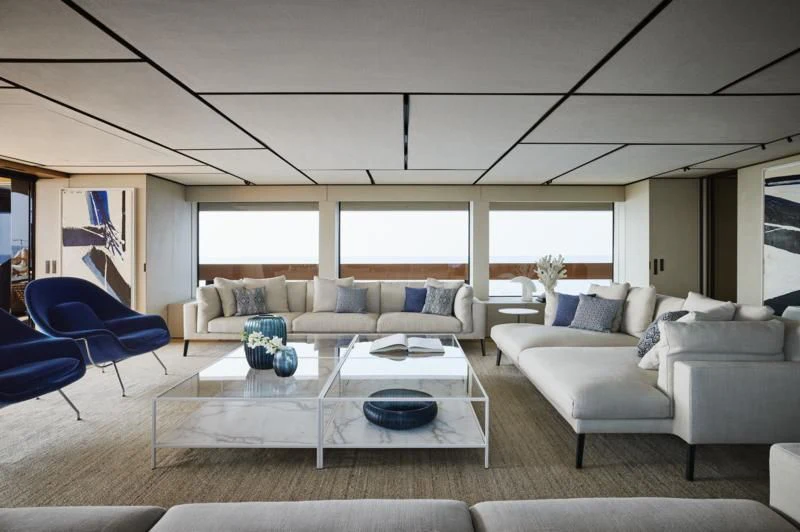 a living room with a table and chairs aboard LA LA LAND Yacht for Charter