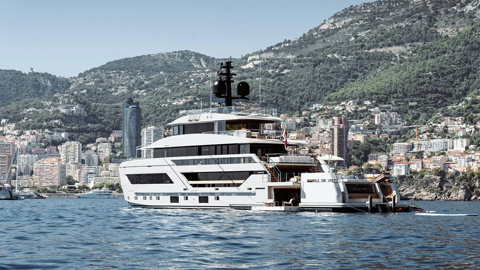 a boat on the water with Hydra in the background aboard LA LA LAND Yacht for Charter
