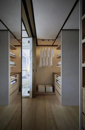 a bathroom with a closet and a mirror aboard LA LA LAND Yacht for Charter