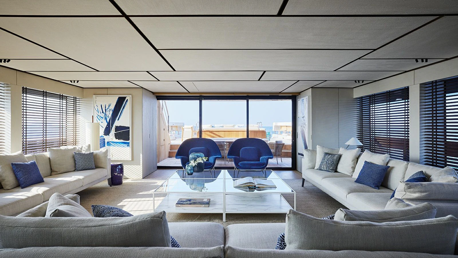 a living room with a large glass window aboard LA LA LAND Yacht for Charter