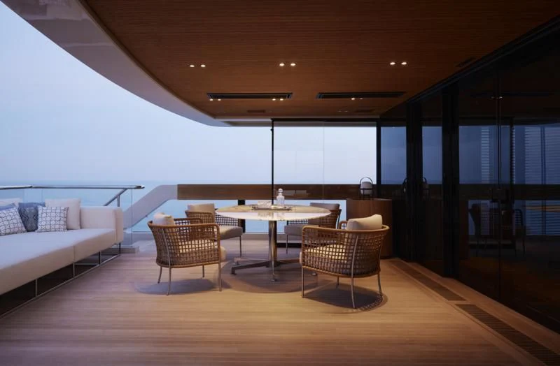 a room with a table and chairs aboard LA LA LAND Yacht for Charter