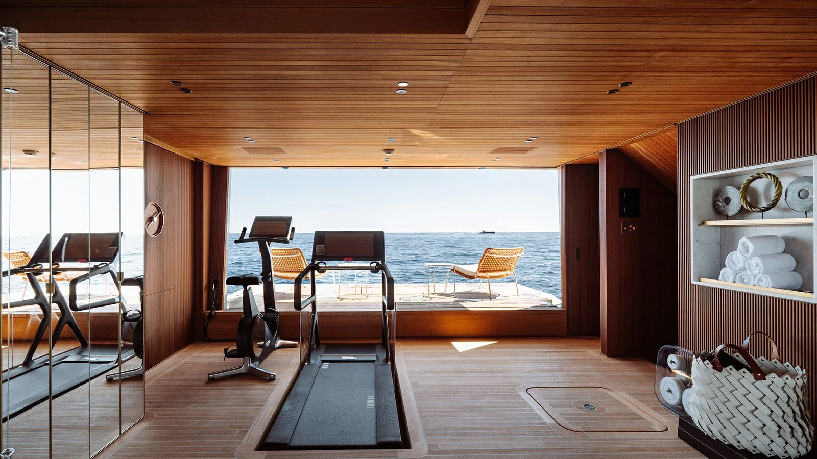 a room with a table chairs and a bench aboard LA LA LAND Yacht for Charter