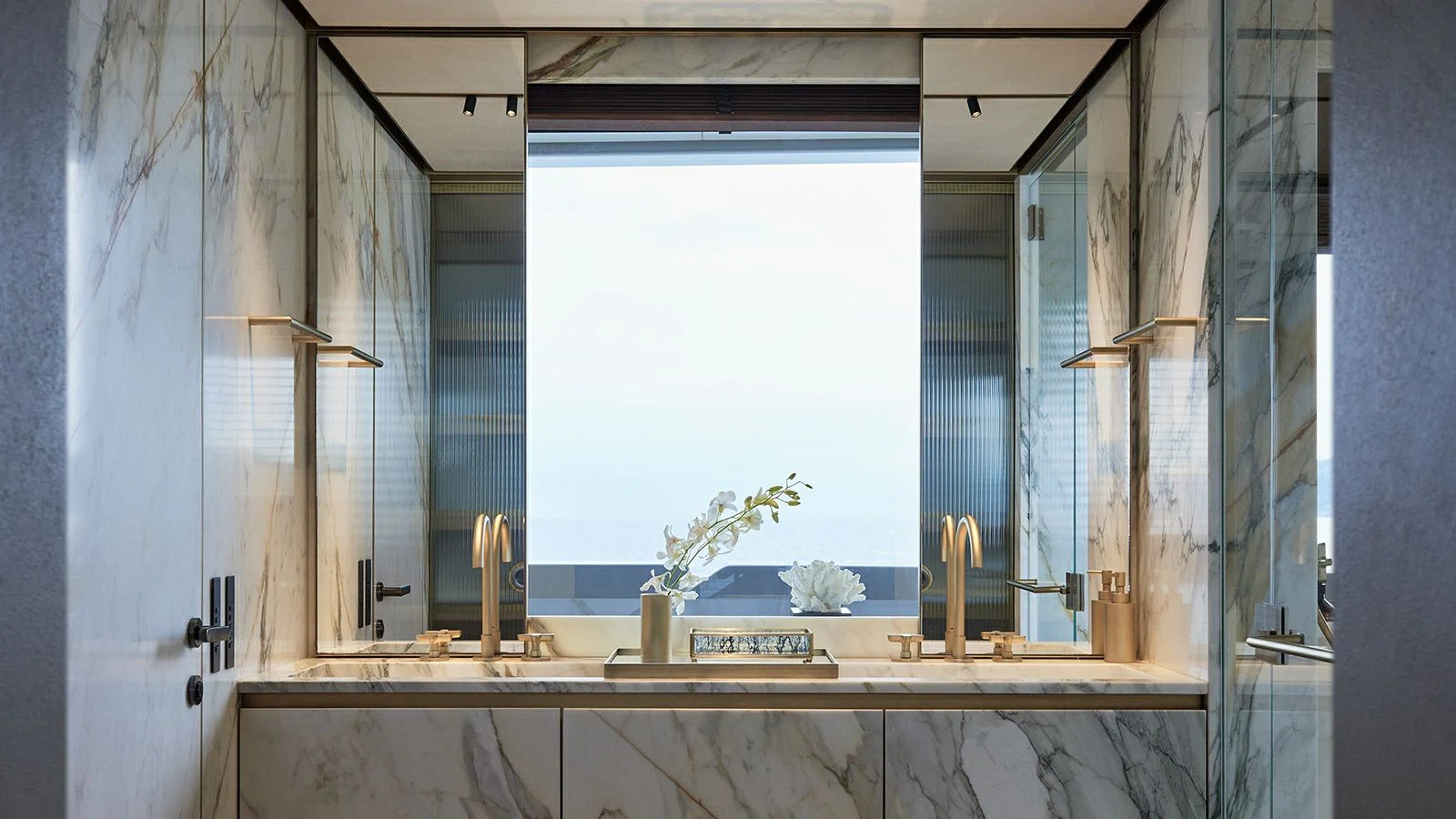 a counter with a window and a sink in a room aboard LA LA LAND Yacht for Charter