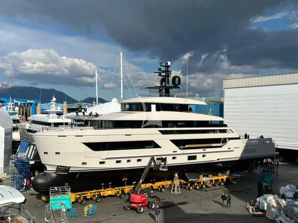 a white yacht in a harbor aboard LA LA LAND Yacht for Charter