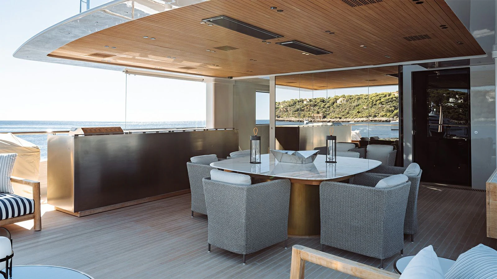 a large living room with a table and chairs aboard LA LA LAND Yacht for Charter