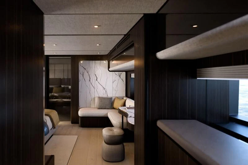 a room with a couch and a table aboard REV Yacht for Sale