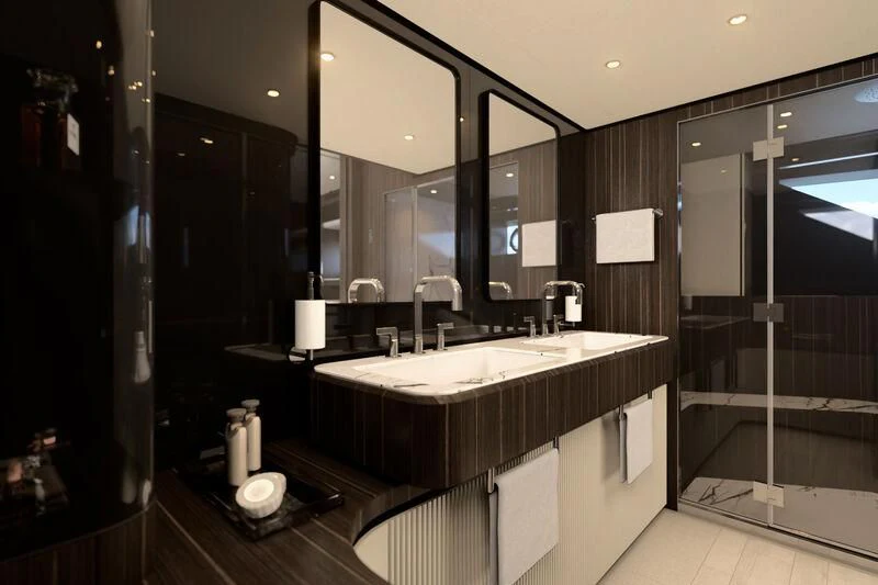 a bathroom with a large mirror aboard REV Yacht for Sale