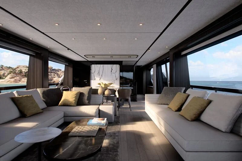 a living room with a large window aboard REV Yacht for Sale