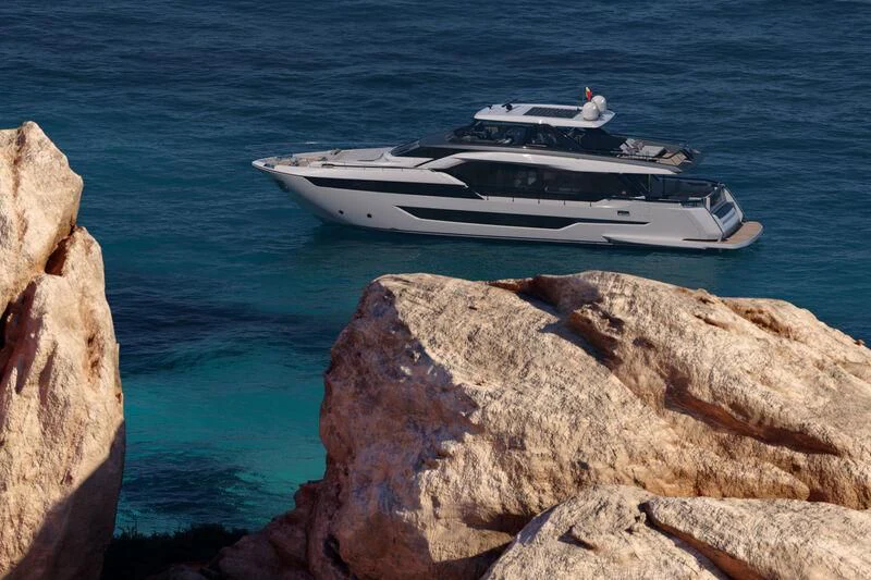 a white yacht on the water aboard REV Yacht for Sale