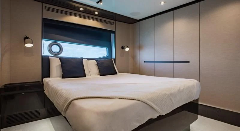 a bed in a room aboard BASH II Yacht for Sale