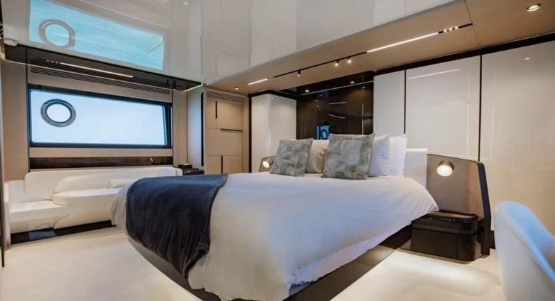 a room with a bed and a tv aboard BASH II Yacht for Sale