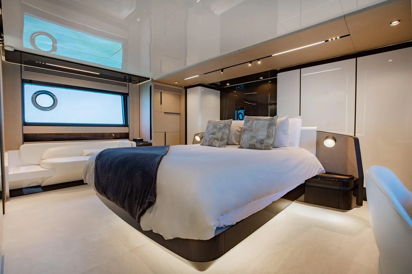 a large bed in a room aboard BASH II Yacht for Sale