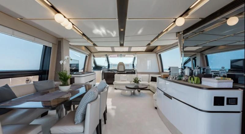 a room with a couch and a table and chairs aboard BASH II Yacht for Sale