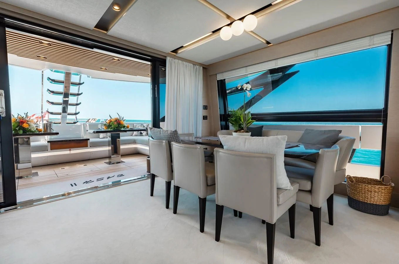 a room with a table and chairs aboard BASH II Yacht for Sale