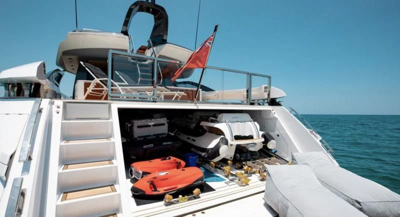 a boat with a flag on the front aboard BASH II Yacht for Sale