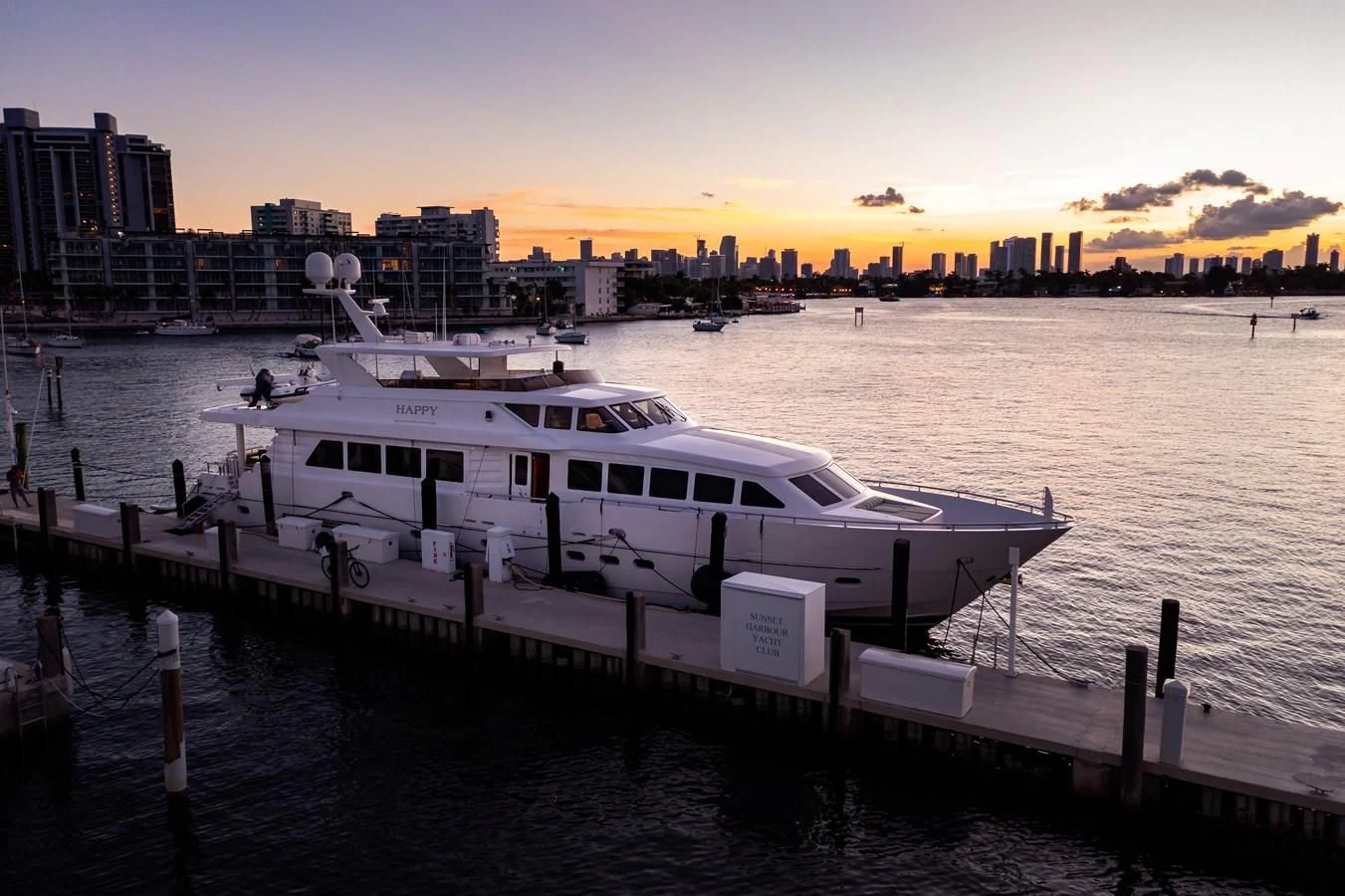 a boat docked at a pier aboard HAPPY Yacht for Sale