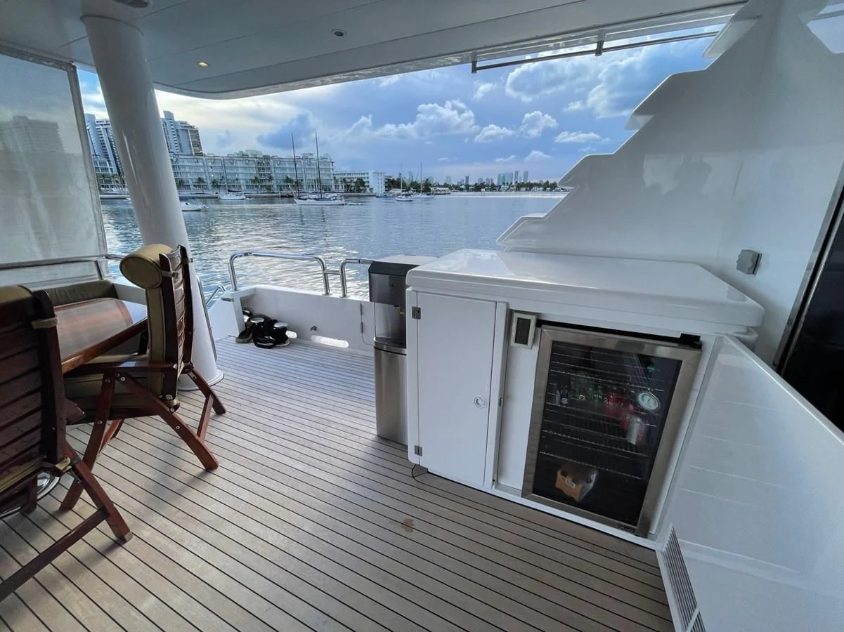 a room with a fireplace and a view of a city aboard HAPPY Yacht for Sale