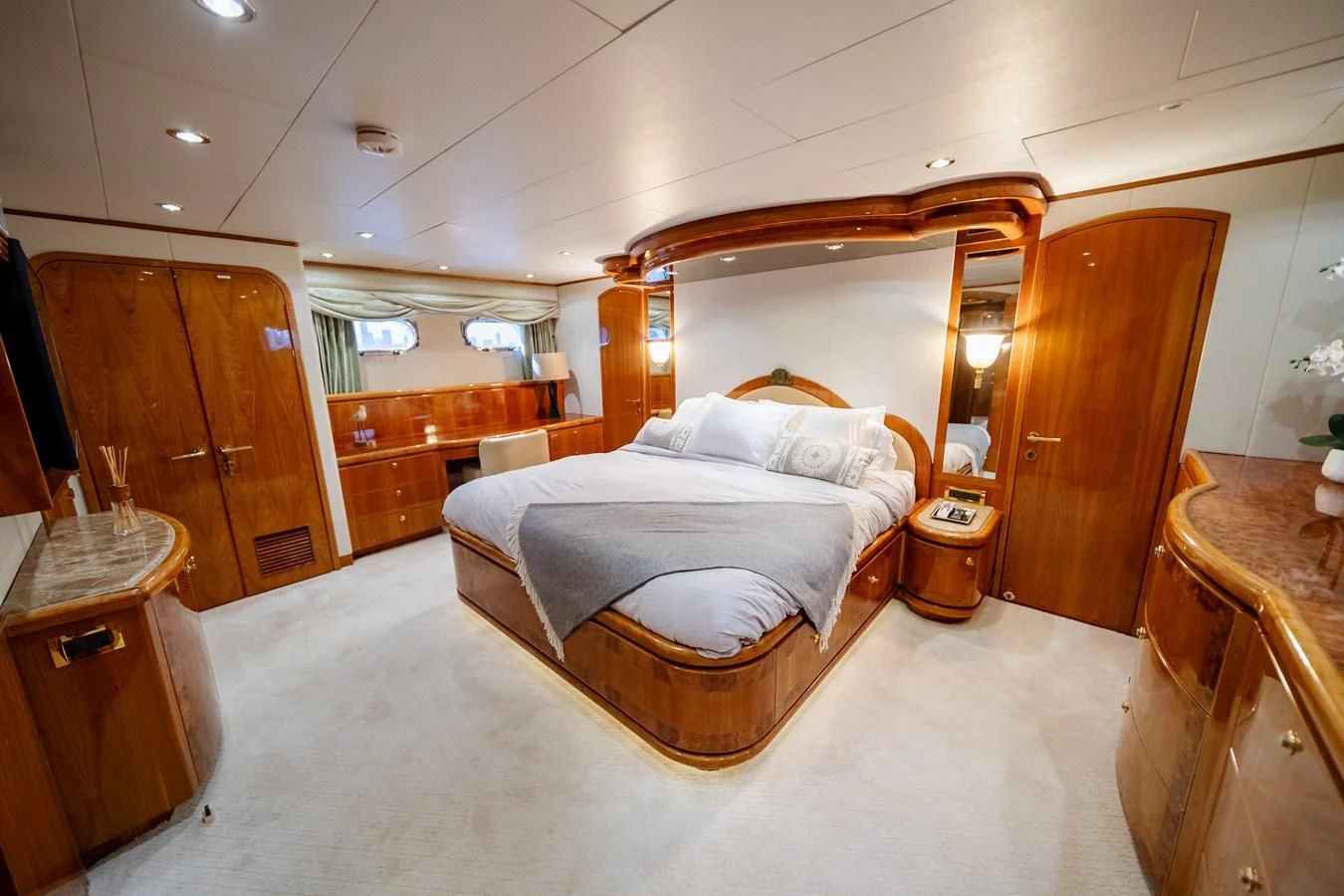 a large bedroom with a bed aboard HAPPY Yacht for Sale