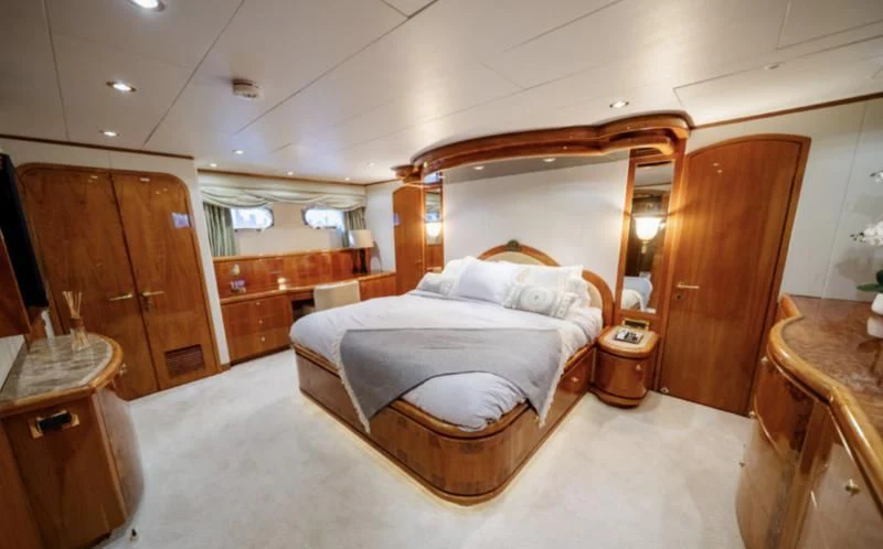 a bed in a room aboard HAPPY Yacht for Sale