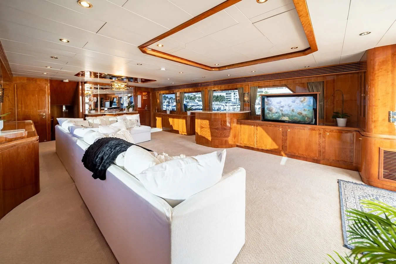 a person lying on a couch aboard HAPPY Yacht for Sale