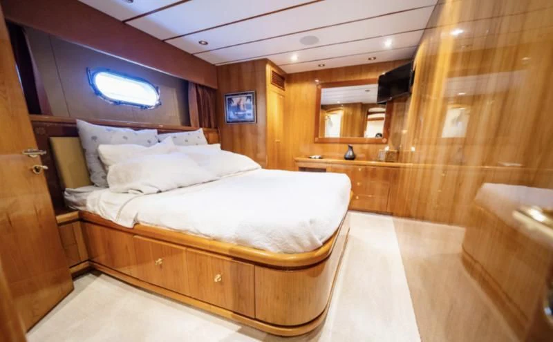 a bed in a room aboard HAPPY Yacht for Sale
