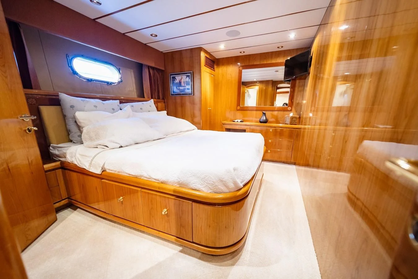 a room with a bed and a window aboard HAPPY Yacht for Sale