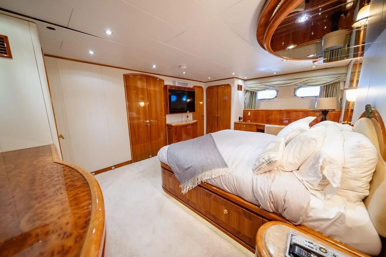 a room with a bed and a television aboard HAPPY Yacht for Sale