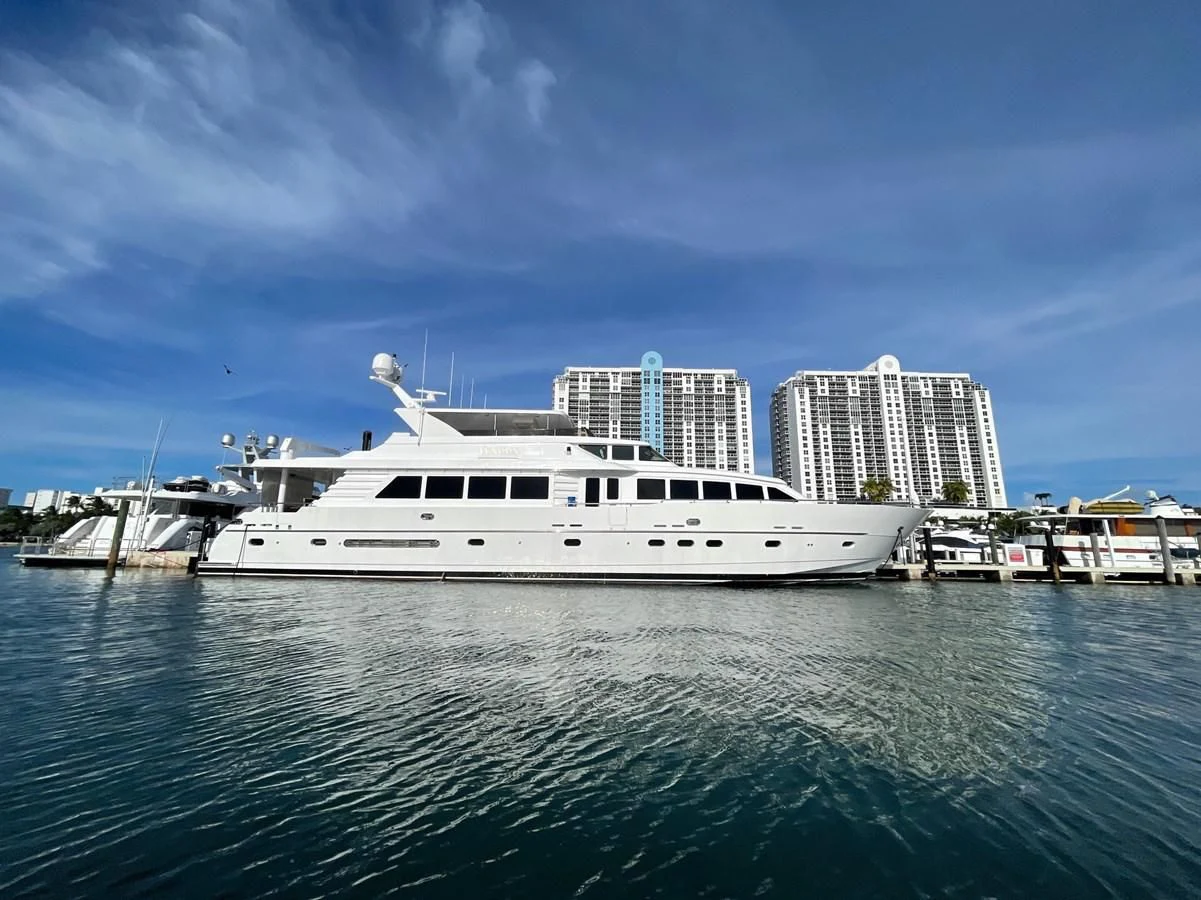 a large white boat in the water aboard HAPPY Yacht for Sale