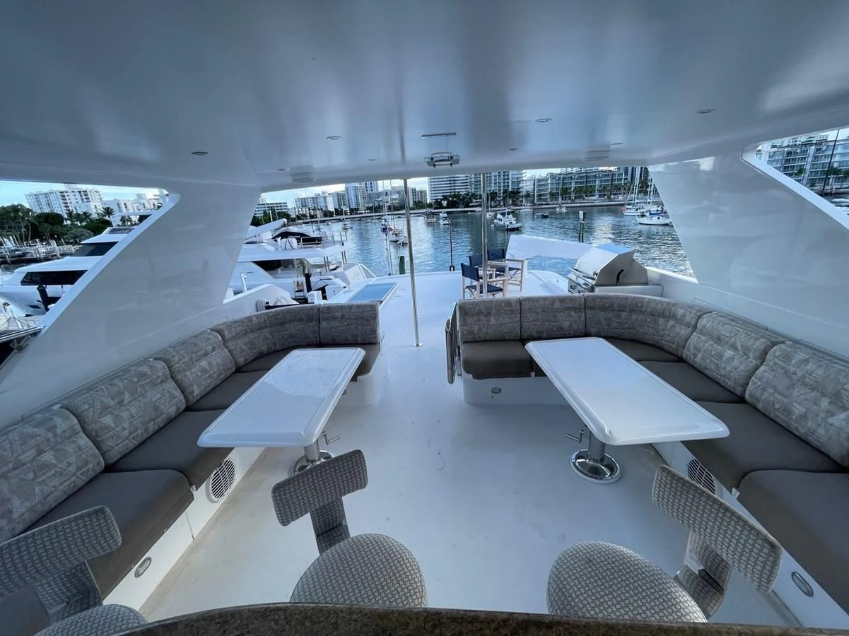 a room with a view of the water and a city aboard HAPPY Yacht for Sale