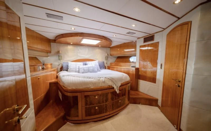 a bed in a room aboard HAPPY Yacht for Sale