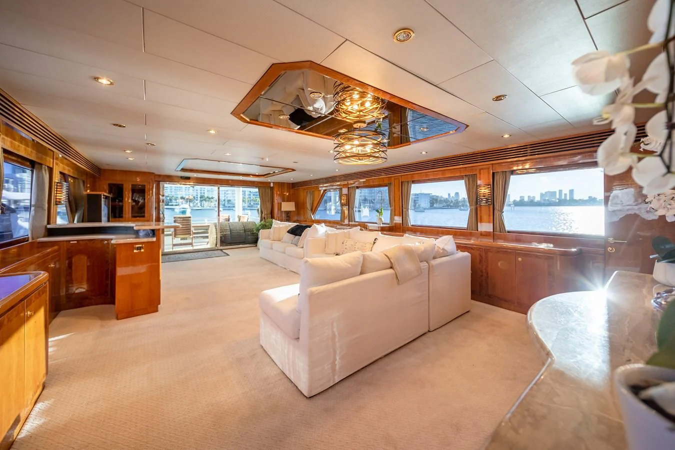 a large living room with a large screen aboard HAPPY Yacht for Sale