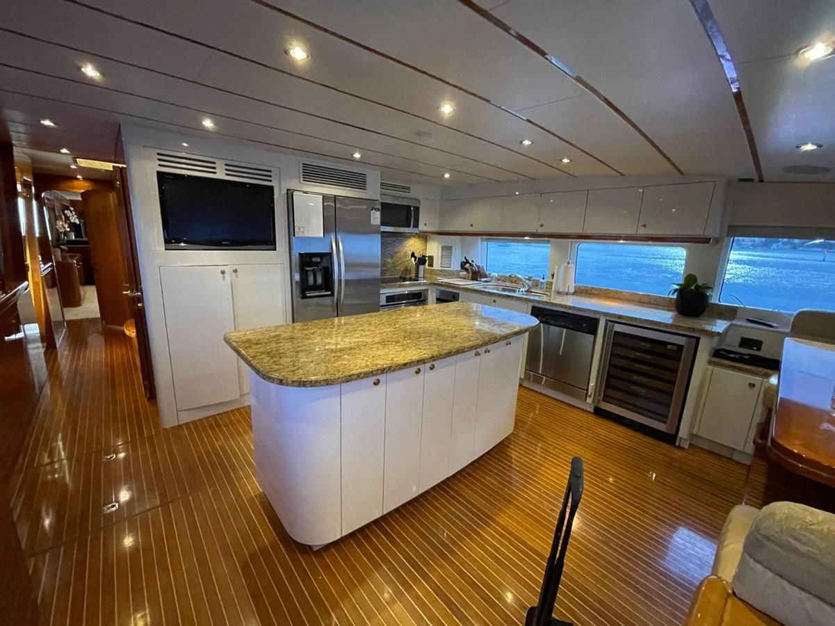 a large kitchen with a large island aboard HAPPY Yacht for Sale