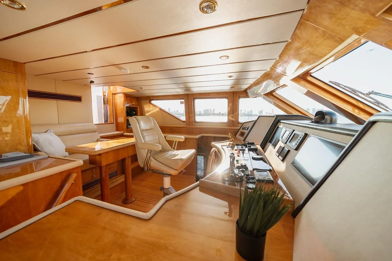 a room with a desk and chairs aboard HAPPY Yacht for Sale
