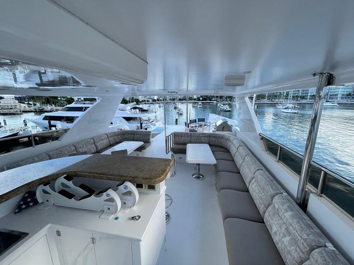 a room with a view of the water and boats aboard HAPPY Yacht for Sale