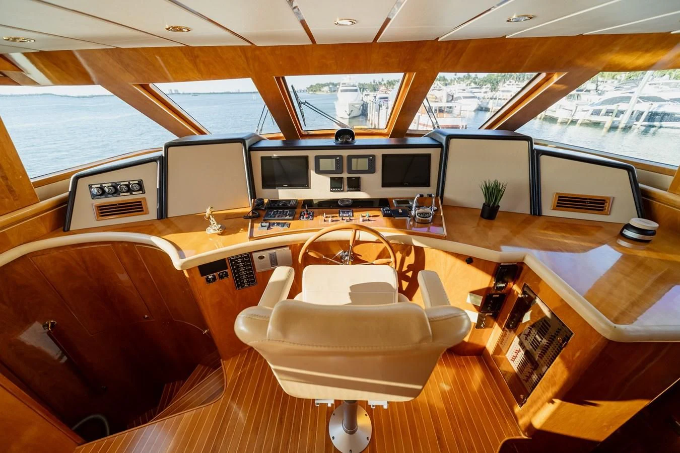 a room with a couch and a table with chairs aboard HAPPY Yacht for Sale
